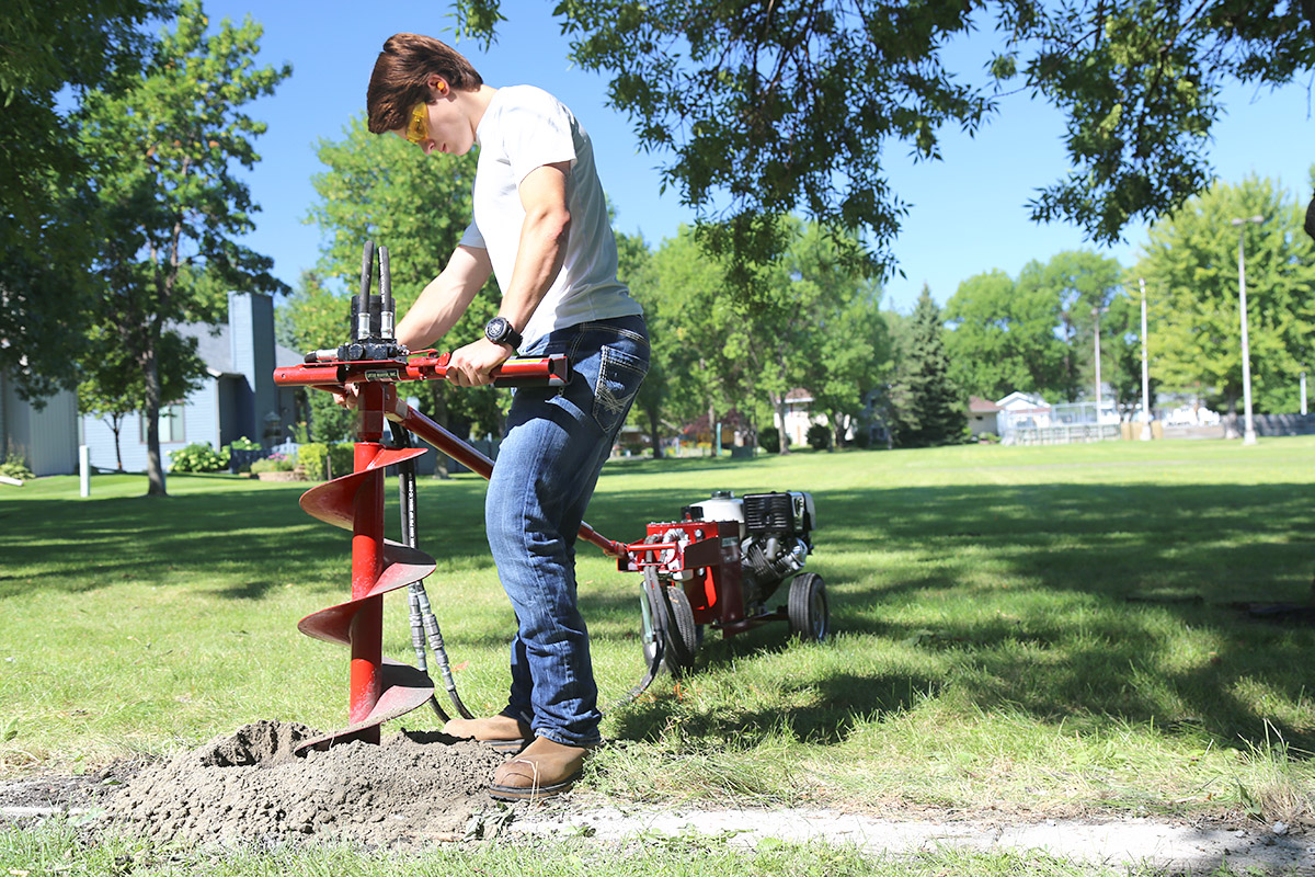 Post Hole Digger In Action by Little Beaver